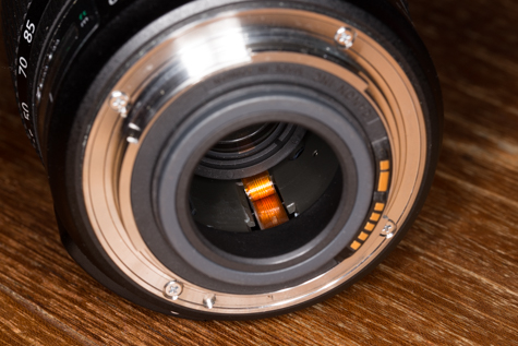 Detail of the rear of an EF-S 15-85mm lens. All unprotected, not a good idea to take this setup out shooting.