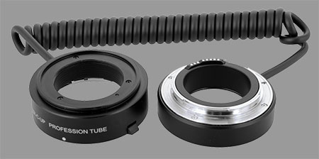 Meike Reverse Ring for Canon EF(-S) mount. This ring enables you to reverse lenses AND keep them powered by the camera.
