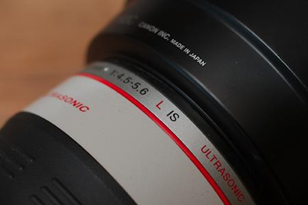 Detail of the Canon EF 100-400L IS USM lens. Note the L indication and the red stripe across the lens which Canon uses to indicate it is an L-grade lens.